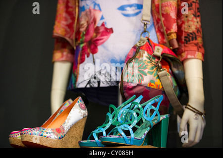 Detailed view, fashion, shoes, a shirt and a handbag at the back Stock Photo