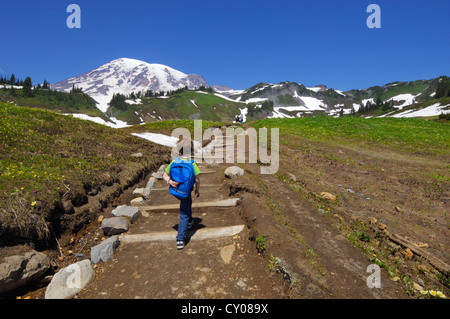 5 year old boy hiking the trail to Myrtle Falls in the Paradise Region of Mount Rainier National Park, Washington, USA Stock Photo