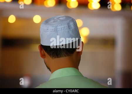 Muslim man, rear view, National Mosque, Kuala Lumpur, Malaysia, Southeast Asia, Asia Stock Photo