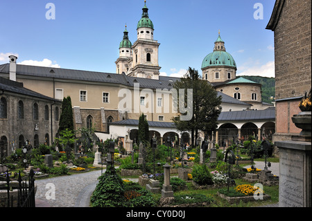 St. Peter's Cemetery, the oldest Christian burial site of Salzburg, Salzburg Cathedral at back, St. Peter's district, Salzburg Stock Photo