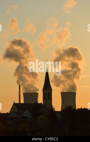 Church of Roethlein in front of Grafenrheinfeld nuclear power plant, silhouetted at dusk, Schweinfurt, Bavaria Stock Photo