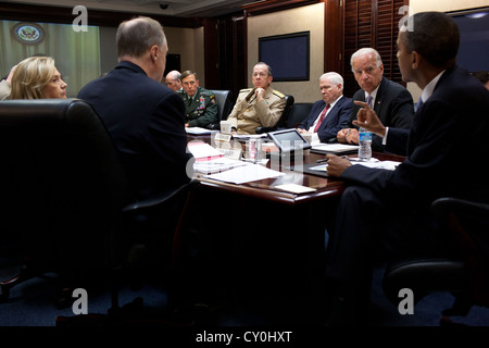 US President Barack Obama meets with his National Security Staff June 21, 2011 in the Situation Room of the White House. From left, are: Secretary of State Hillary Rodham Clinton; National Security Advisor Tom Donilon; Chief of Staff Bill Daley; General David Petraeus, Commander, U.S. Central Command; Chairman of the Joint Chiefs of Staff Admiral Mike Mullen; Secretary of Defense Robert Gates; and Vice President Joe Biden. Stock Photo