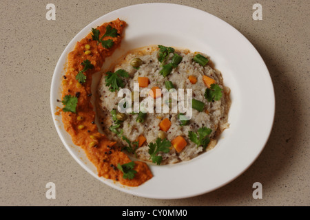 Upma or uppuma is a popular South Indian breakfast dish. Upma is usually made with Semolina (called Rava or Suji in India). Stock Photo