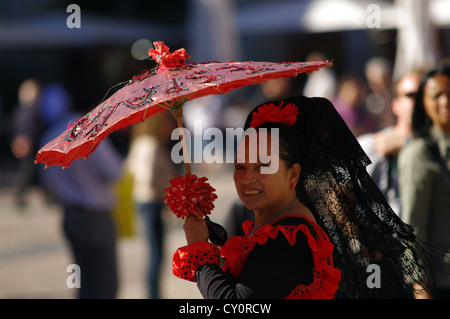 Woman in traditional Spanish clothing, Plaza Mayor, Madrid Stock Photo