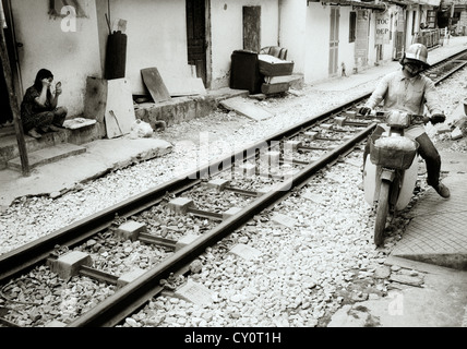 Life beside the train tracks in Old City of Hanoi in Vietnam in Far East Southeast Asia. Slum Rail Railway Poverty Urban Reportage Lifestyle Travel Stock Photo