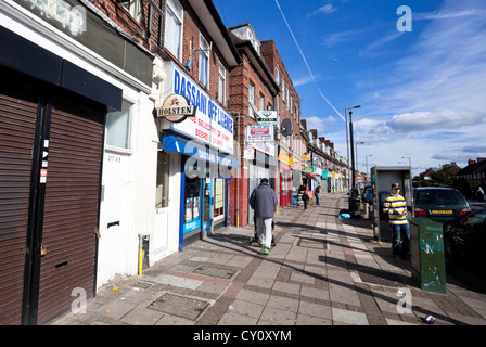 Row of shops on Deansbrook Road high street, Mill Hill, London, England, UK. Stock Photo