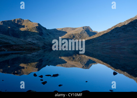 Y Garn, Foel Goch and Pen Yr Ole Wen reflected in the still waters of Llyn Ogwen Lake Snowdonia Gwynedd North Wales UK Stock Photo