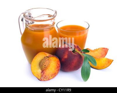 peach juice in a jug and a glass of fruit Stock Photo