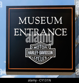 Entrance sign to the Harley Davidson Museum with Harley Davidson motorcycles parked outside, Milwaukee, Wisconsin, USA Stock Photo