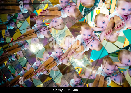 Through eye contact with a kaleidoscopic reflection, a five-year-old boy with autism discovers a new visual input. Stock Photo