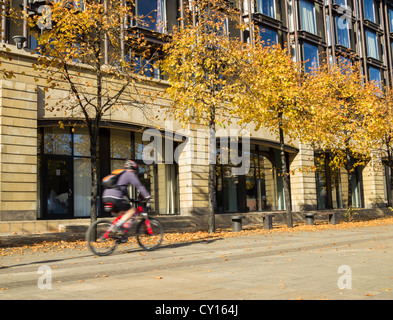 Cyclist passing The Copthorne hotel on The Quayside in Newcastle upon Tyne, England, UK Stock Photo