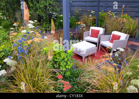 Relaxing area in contemporary designed garden. Stock Photo