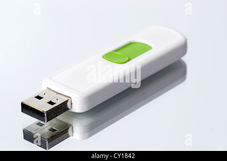 USB flash drive on mirror, glossy background. Stock Photo