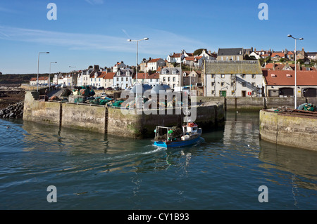 Fishing boat returning from fishing and entering Pittenweem Harbour in Fife Scotland Stock Photo