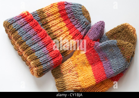 Brightly coloured knitted hat and mitts isolated on white background - home made, hand crafted Stock Photo