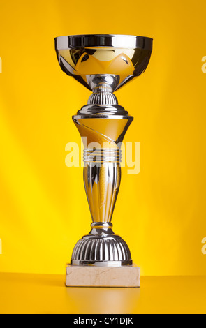 golden cup on yellow background