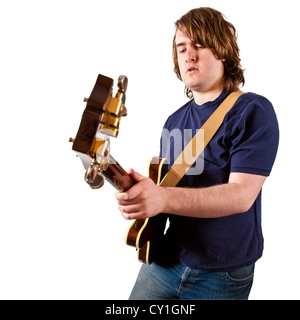 Guitarist. Young man playing an electric guitar isolated on a white background Stock Photo