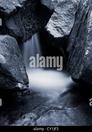 Waterfall with large boulders Stock Photo