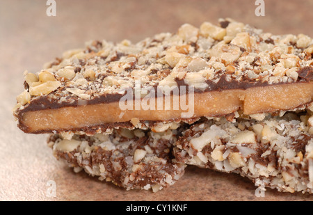 Delicious Dark Chocolate English Toffee with chopped pecan nuts Stock Photo