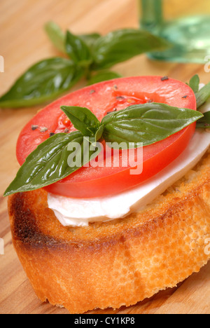 Delicious Bruschetta with tomato, mozzarella and basil Stock Photo