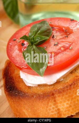 Delicious Bruschetta with tomato, mozzarella and basil Stock Photo