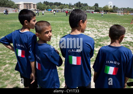 children player playing football field tournament Stock Photo