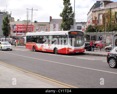 Single Decker 'Bus Eireann' service bus, 405-Rahoon, alighting passengers in Eyres Square, Galway City in the west of Ireland. Stock Photo