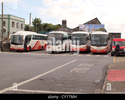 An assemblage of Irish Bus Eireann buses parked at Galway City train and bus station in the West of Ireland. Stock Photo