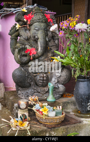 Shrine to the Hindu God Ganesh, protecting the entrance to a house, Ubud, Bali, Indonesia. Stock Photo