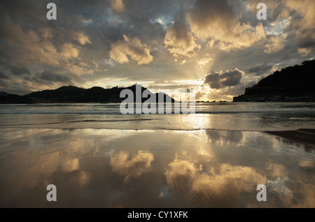 Reflection at sunset on La Concha beach, San Sebastian, the Basque Country, Spain Stock Photo