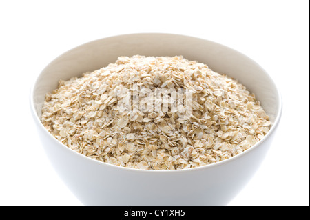 porridge oats dry uncooked in a white bowl Stock Photo