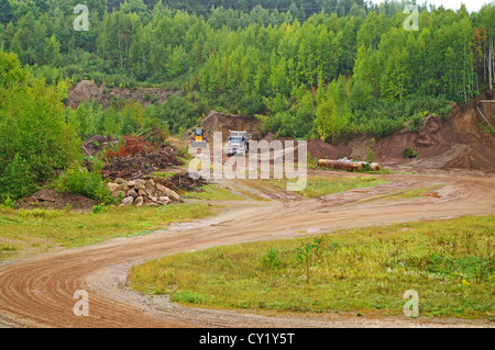 A dump truck being loaded with gravel Stock Photo