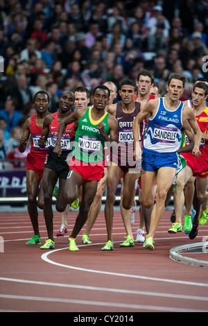 Dawit Wolde (ETH) and Niclas Sandells (FIN) lead the pack competing in the men's 1500m first round at the Olympic Summer Games Stock Photo