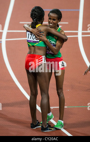 Tirunesh Dibaba (ETH) wins the gold medal in the women's 10000m and is congratulated by teammate Werknesh Kidane Stock Photo