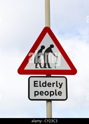 ELDERLY PEOPLE ROAD TRAFFIC SIGN AGAINST BLUE SKY UK Stock Photo ...