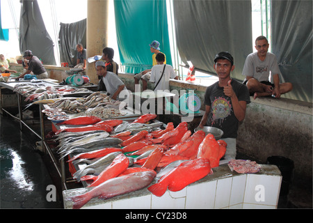 Asian Red Snapper fish seller in the Central Market, Sandakan waterfront, Sabah, Borneo, Malaysia, Southeast Asia Stock Photo