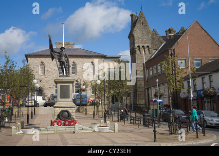 Dungannon Co Tyrone Northern Ireland War memorial in Market square with ornate former police barracks in right hand corner on lovely autumn day Stock Photo