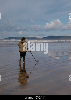 Man metal detecting on the beach at Westward Ho!, Devon, UK Stock Photo