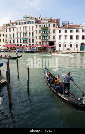 Gondolas on Grand Canal near Rialto Bridge, Venice, Veneto, Italy Stock Photo