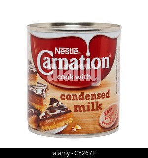 A tin of Nestle Carnation condensed milk on a white background Stock Photo