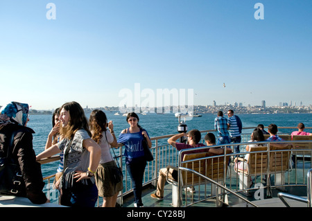 Passengers on an Istanbul ferry in the Sea of Marmara near the Strait of Bosphorus going to Kadikoy on the Asian side of the city, in Turkey. Stock Photo
