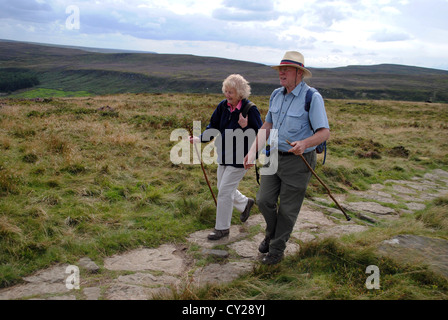 Husband and wife hiking at the Wainstones, cleveland hills. Stock Photo