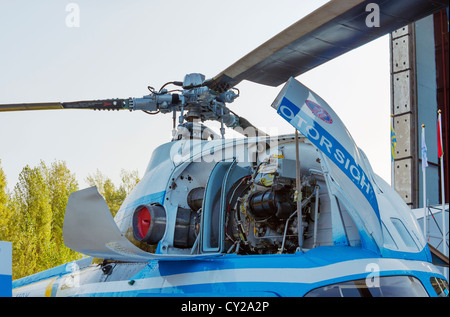 Upgraded Mi-2MSB ( MSB-2) helicopter. Front view of open covers of an turbine compartment of the helicopter. Stock Photo