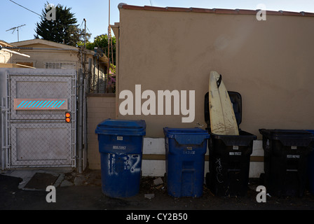 surf board in a trash can venice california Stock Photo