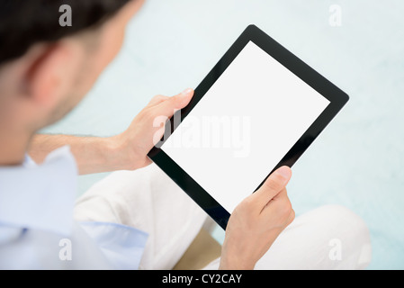 Man holding blank digital tablet in hands. Stock Photo
