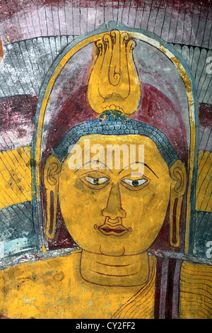 Wall painting frescoes inside Dambulla Cave ancient Buddhist Temple in Dambulla, Sri Lanka Stock Photo