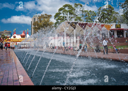 Water feature in Sydneys Darling Harbor area. A row of water jets make a stunning water fountain feature. Stock Photo
