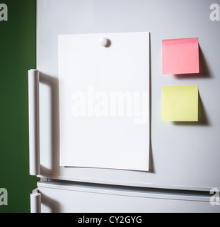 Empty paper sheet on fridge door Stock Photo