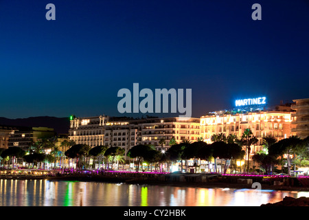 The famous art deco style Grand Hotel Martinez and Carlton on the Croisette at Cannes at dusk, France