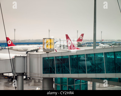 Atatürk International airport in Istanbul Turkey pier 225 with planes belonging to Turkish airlines and Cargo Stock Photo